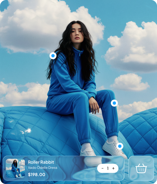 Model in a blue tracksuit sitting on a blue quilted seat, with a